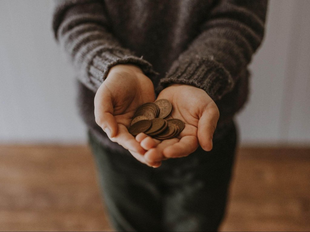 man holding coins