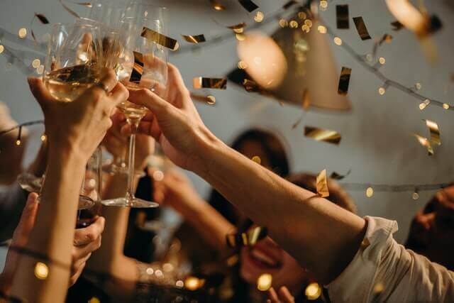 People toasting wine glasses