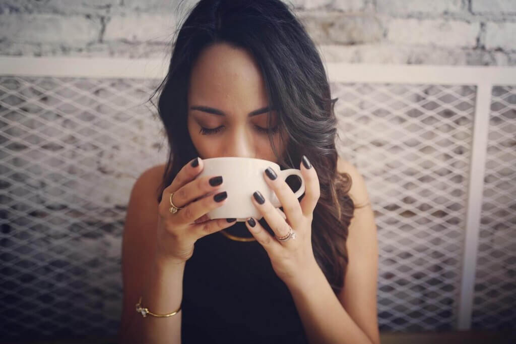 A woman drinking coffee